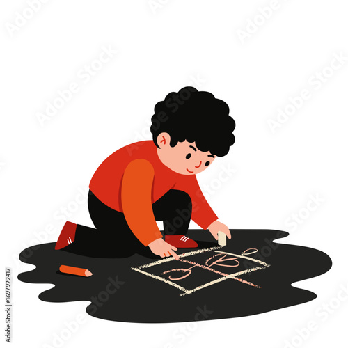 Young boy drawing with chalk on driveway while sitting on ground  