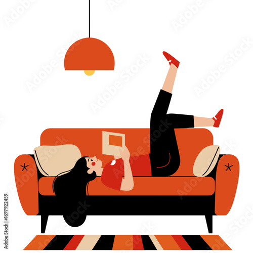 Girl reading a book while lying upside down on an orange sofa  