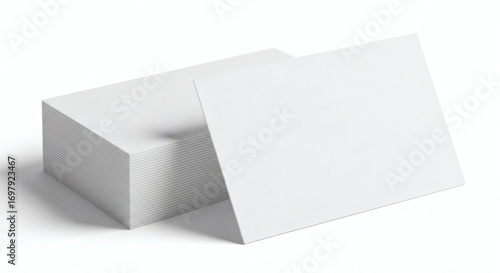 A stack of blank textured white business cards with one card angled in the foreground creating a clean and minimalist presentation