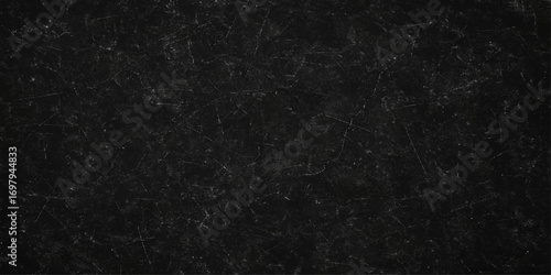 Black, dark, and gray rain drops on textured fabric and rough surfaces create a macro pattern