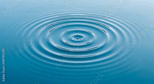 Concentric Ripple Water An abstract concentric ripple in calm blue water from an overhead view creating a serene pattern