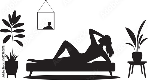 Silhouette of a woman posing on a chaise lounge with plants and framed art reclining
