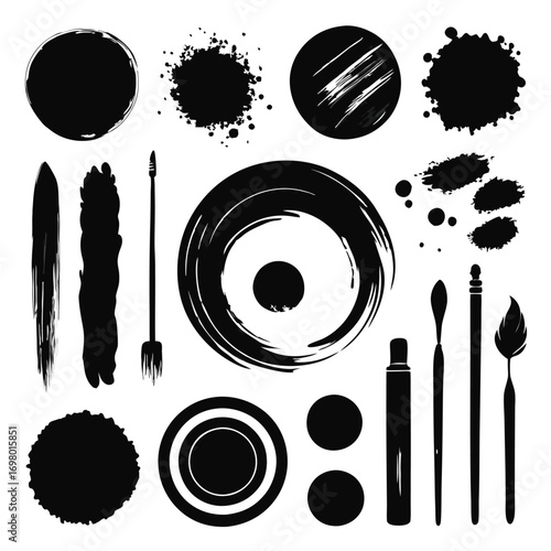 Collection of various black ink brush strokes, splatters, and cosmetic tools on a white background.