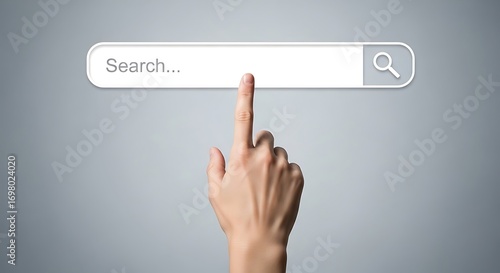 Hand pointing at a search bar on a gray background.