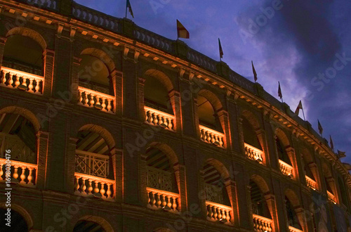Illuminated Plaza de Toros bullring in Valencia at night