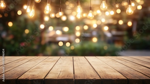 Wooden table, blurred outdoor garden scene, warm lights