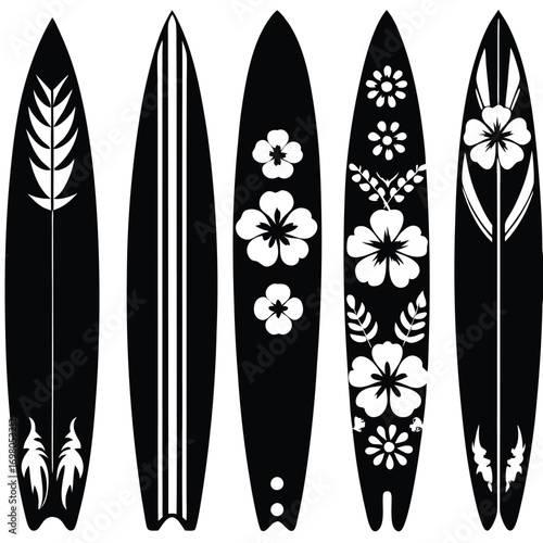 Five black surfboards with white floral and stripe designs.