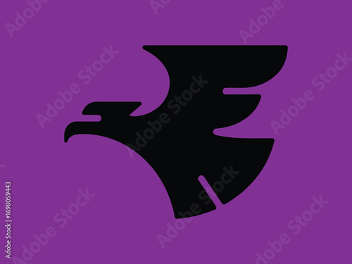 Modern eagle head silhouette logo. Powerful hawk mascot symbol for a sports team, gaming, or security business identity