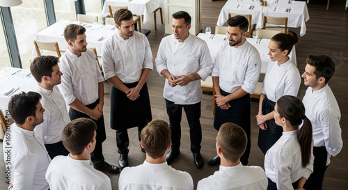 Head chef briefing team in fine dining restaurant