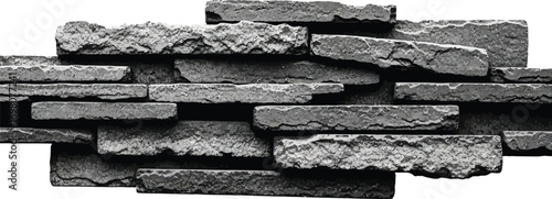 Monochrome close-up of a textured stacked stone wall.