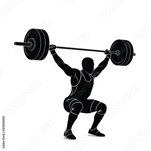Weightlifter lifting barbell overhead in silhouette