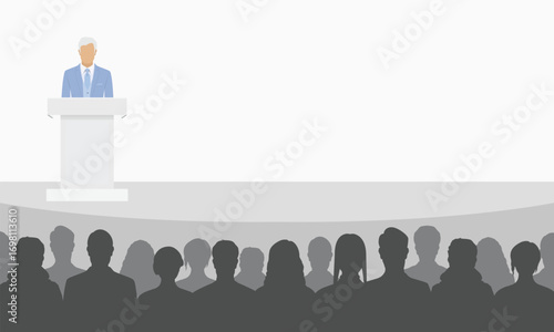 Businessman standing behind a podium tribune while giving public speech