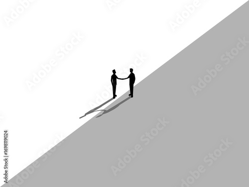 Two businessmen stand and shake hands and agree on different business deals