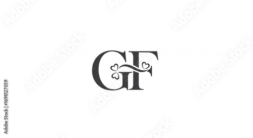 Elegant Black Monogram Logo with Floral and Heart Accents on White Background