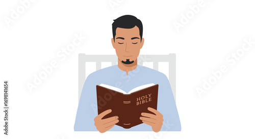Man with goatee reading a Bible sitting in bed
