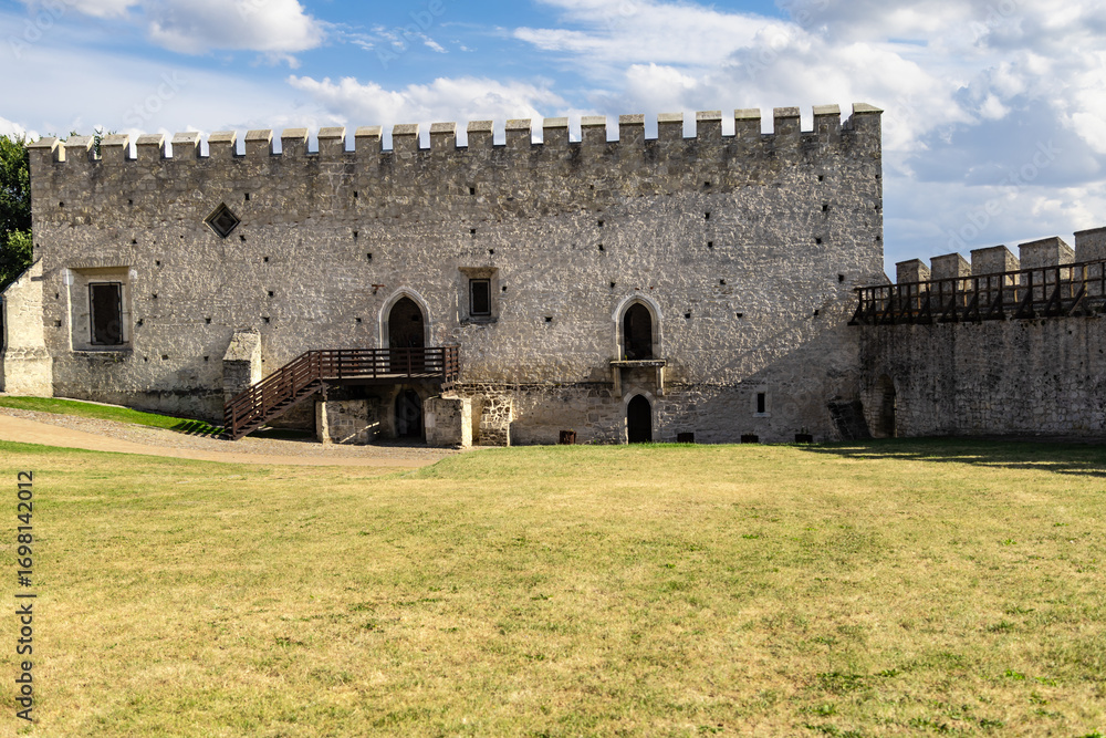 Obraz premium Medieval stone royal castle and defensive walls. Szydlow, Swietokrzyskie Province, Poland