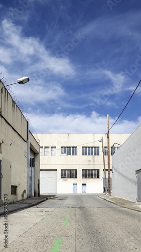 factory and industrial complex with passing clouds in vertical