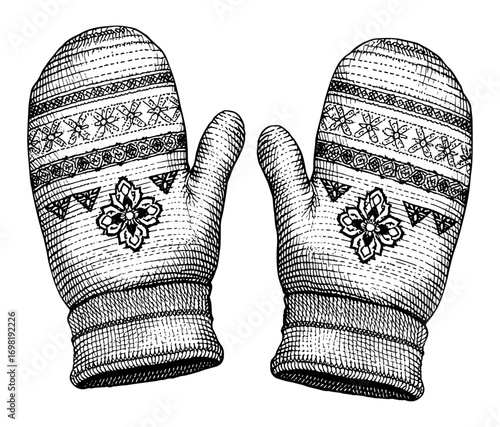 A pair of vintage-style knitted mittens with snowflake design, in black and white