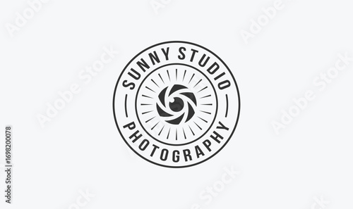 studio photographer stamp logo design with the sun and lens element.
