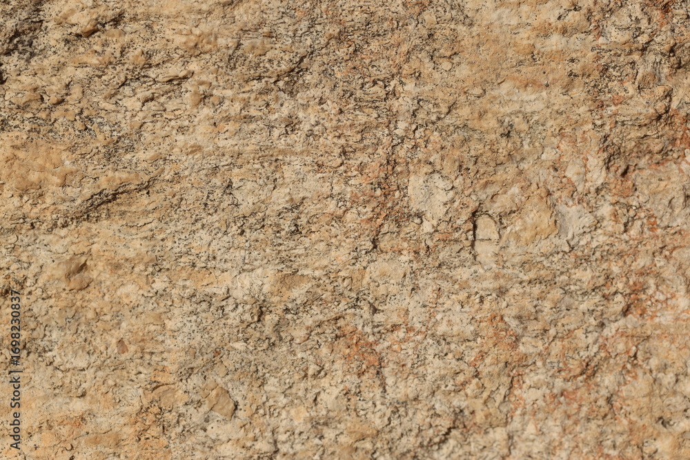 close up of yellow stone surface texture 