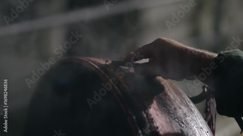 Wallpaper Mural Man is cleaning a copper boiler of homemade distillery. Making moonshine schnapps, alcoholic beverages such as brandy, cognac, whiskey, bourbon, gin, and scotch, slow motion Torontodigital.ca