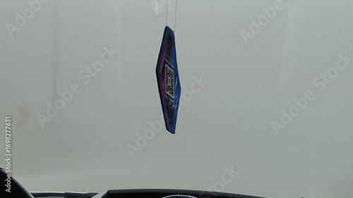 Medium shot from the perspective of a passenger inside a car, capturing a winding mountain road shrouded in dense fog in the highlands of the ecuadorian andes. 