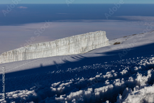 Mount Kilimanjaro hiking trail, way to the summit of mount Kili the highest volcano in Africa, Tanzania. View from top of mountain Kilimanjaro. Snow and glacier on top of Kilimanjaro, Mount Kili
