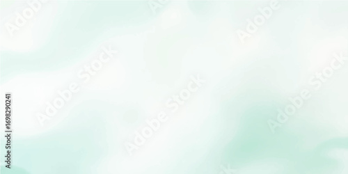 An abstract, soft blue and green cloudscape with a colorful sky background and blurred bokeh lights