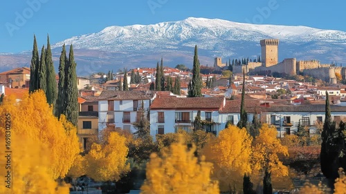 Captivating panorama of Granada Spain in autumn with snow-capped mountains in the backdrop