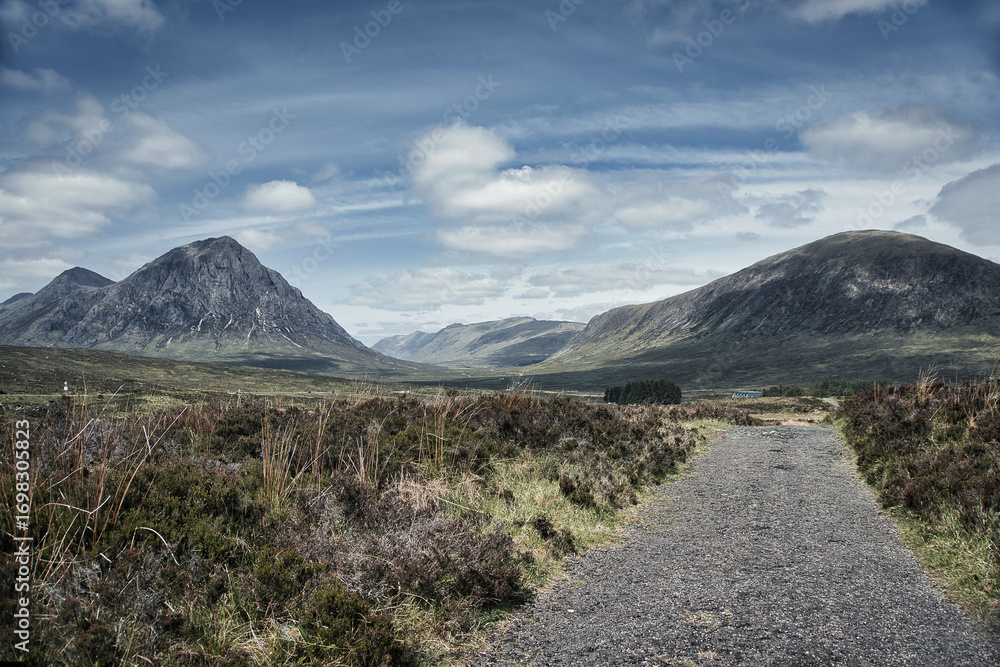 Fototapeta premium Vibrant Glencoe Mountain Resort campsite in Scotland surrounded by mountains