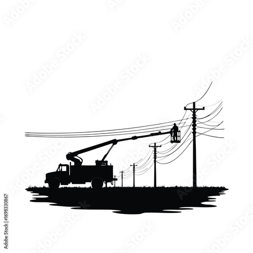 Silhouette of utility worker in bucket truck repairing power lines