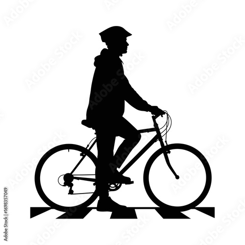 Cyclist wearing helmet on a bicycle at a crosswalk silhouette isolated on white background