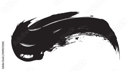 A close-up photograph of black paint brush strokes on a white background.  