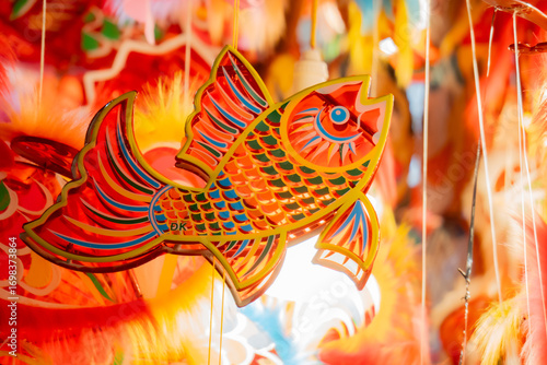 Colorful carp-shaped lantern for Mid-Autumn Festival, traditional handmade decoration symbolizing luck and festivity.
