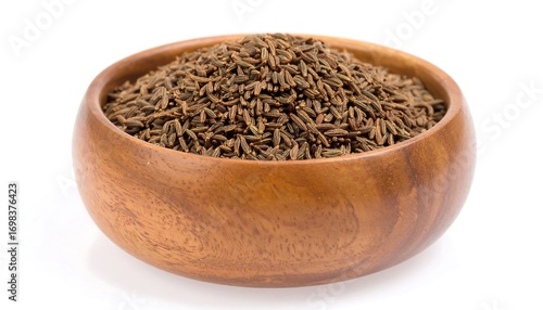 Wooden bowl of cumin seeds
