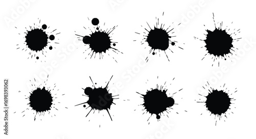 Collection of nine stylized ink blots, exhibiting various splatter patterns against a plain white background.