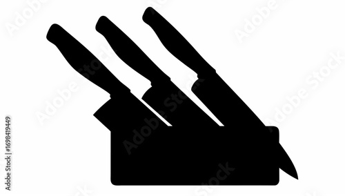 Three kitchen knives are arranged together in a black knife block on a white background in a silhouette