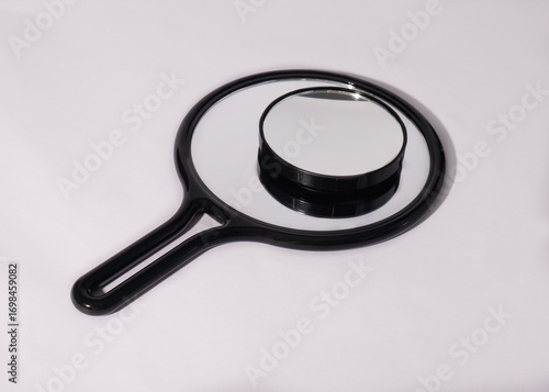 magnifying glass on white background. Two mirrors 