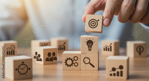 Business strategy and planning with icons for goals, innovation, teamwork, and growth on wooden blocks