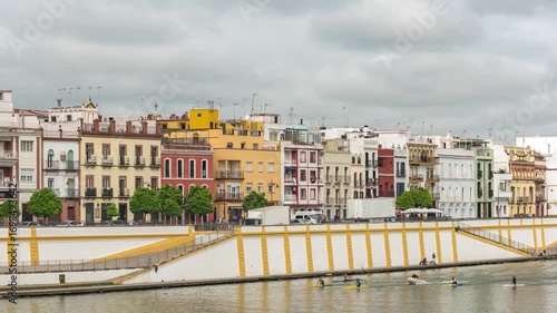 Wallpaper Mural Seville Spain time lapse city skyline at Triana neighborhood and Guadalquivir River Torontodigital.ca