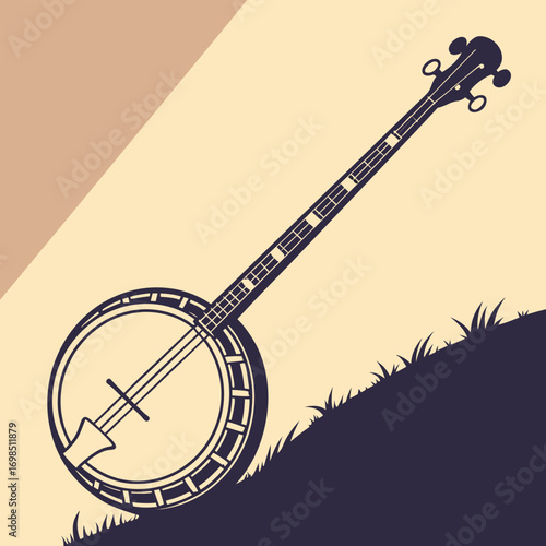 a banjo resting on grass against a two tone background