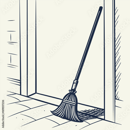 a broom leans against an open doorway on tiled floor