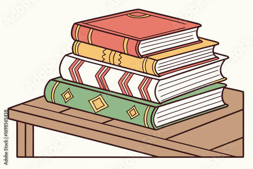 Stack of colorful books on a wooden table