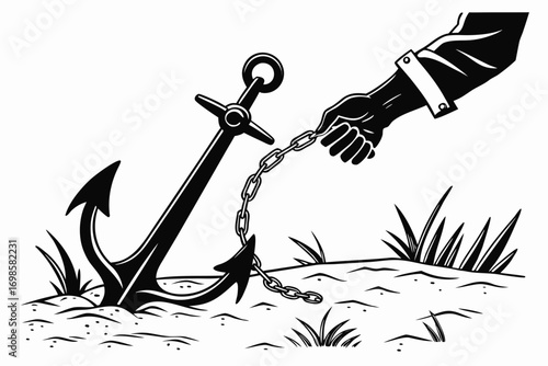 Hand holding anchor chain on sandy ground with grass