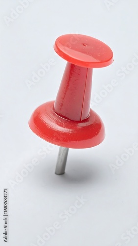 Red pushpin on white background