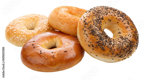 Assorted freshly baked bagels with sesame and poppy seeds on white background for sale at bakery