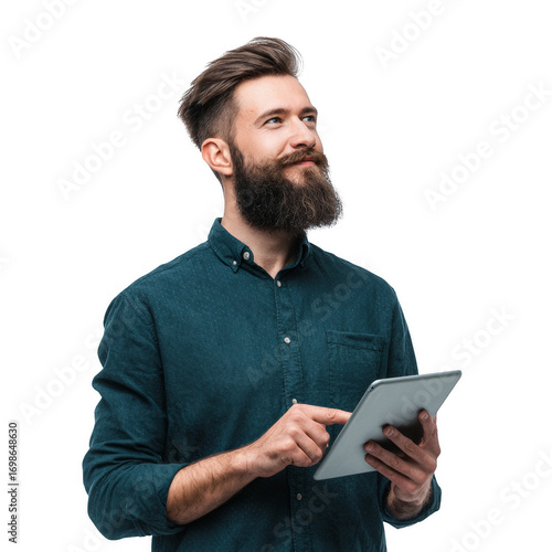A man with a beard and a green shirt is holding a tablet in his hand