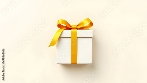 White gift box tied with blue ribbon on clean background