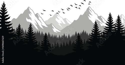 Majestic snow capped mountain peaks rise above a dense evergreen forest with a flock of birds soaring across the sky