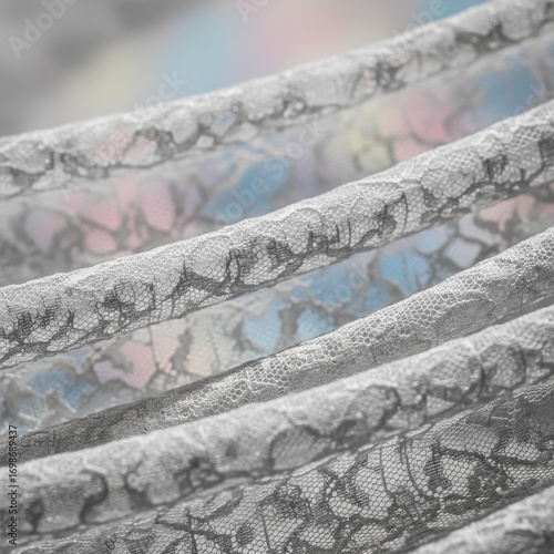 Monochrome macro detail of lace camisole fabric texture, dramatic high-contrast style